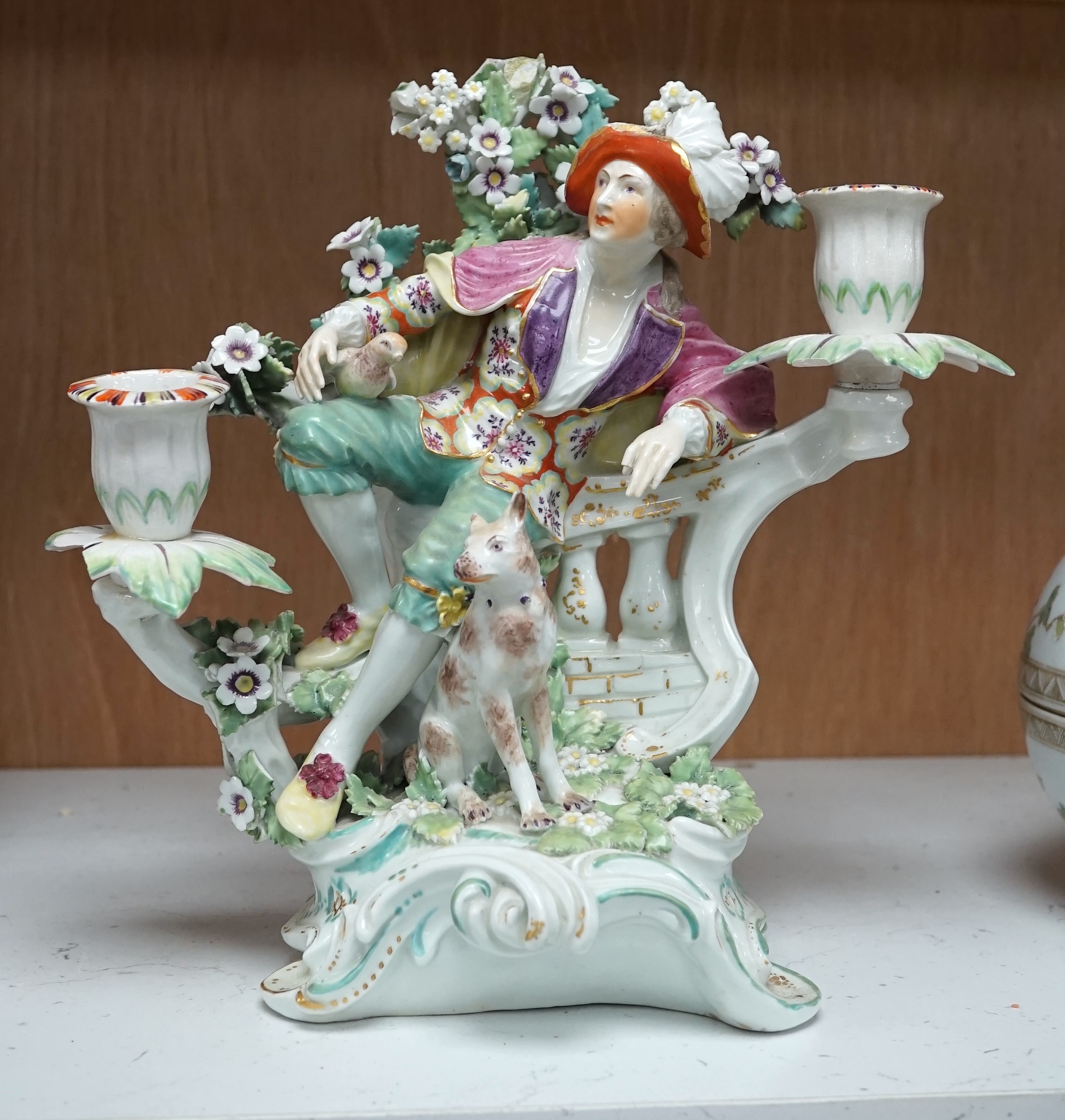 A Derby figural two-branch candelabrum, c.1775, 25cm high. Condition - poor